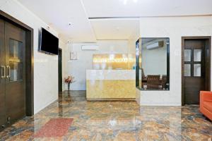 a lobby of a hotel with a waiting room at Collection O Vertigo Suite in Mumbai +26 photos