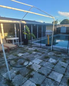a patio with a tent and a swimming pool at PalmBeachLake&PoolFrom69dollarsForPersonDayly 