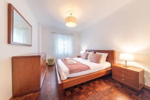 Ένα ή περισσότερα κρεβάτια σε δωμάτιο στο Apartamento Vieira by Mth