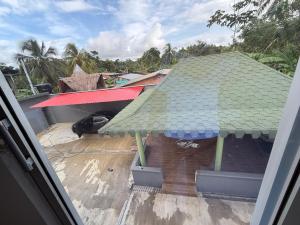 a view of a building with a green roof at SC Essence paradise in Necoclí +3 photos