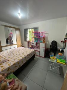 Ένα ή περισσότερα κρεβάτια σε δωμάτιο στο Casa de praia +3 φωτογραφίες