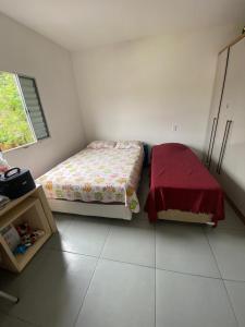 Ένα ή περισσότερα κρεβάτια σε δωμάτιο στο Casa de praia