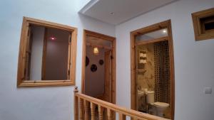 a bathroom with a staircase and a toilet in a house at La casa de Oasis in Essaouira +57 photos