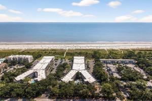 an aerial view of a building next to the beach at Oceanfront Condo - Hilton Head Island in Hilton Head Island