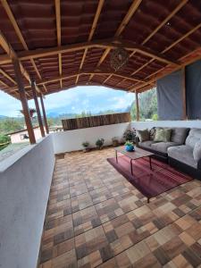 a living room with a couch and a table at Casa Elizabeth en valle de Bravo,Avandaro in Godínez +14 photos