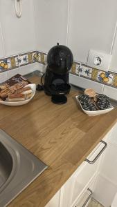 a helmet sitting on a counter with two plates of food at Violeta del Teide in Icod de los Vinos +21 photos