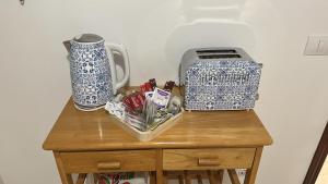 a table with two blue and white items on it at Violeta del Teide in Icod de los Vinos