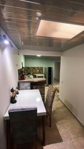 a kitchen with a white table and chairs and a stove at Vélez Loft II in Vélez +15 photos