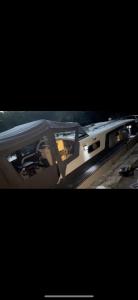a close up of a boat with the window open at 4 berth Boat house in birstall, Leicester in Birstall