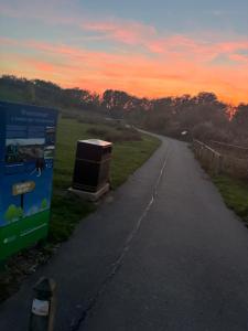 a road with a box sitting on the side of it at 4 berth Boat house in birstall, Leicester in Birstall