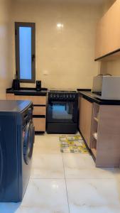Η κουζίνα ή μικρή κουζίνα στο Oumya apartment