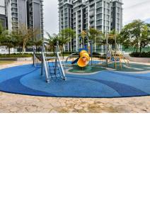 a playground in a park with a slide at Semarak Homestay@Alisya Package in Kajang