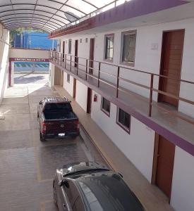 two cars parked inside of a building at Bugambilia Campeche in Campeche