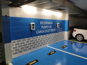 a garage with a car parked in a parking lot at Estudio Casco Histórico II & Parking in Avilés