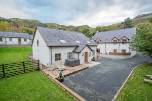an aerial view of a house with a driveway at Helyg in Penmaen-mawr