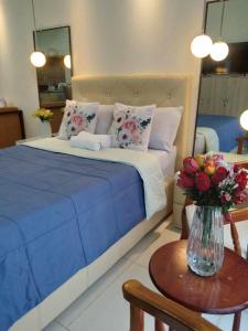 Voodi või voodid majutusasutuse Tagaytay Smdc Wind Residences by Le Grand Liz's Place toas +2 fotot