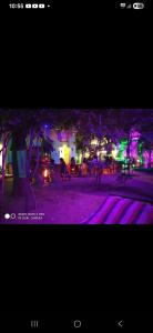 a picture of a street at night with lights at Anand hostel in Pushkar