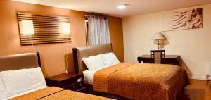 a hotel room with two beds and a window at Sea Haven Resort Motel in Southampton