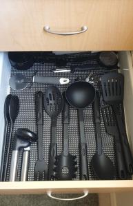 a drawer filled with lots of cooking utensils at The Studio on Ashtree in Armidale