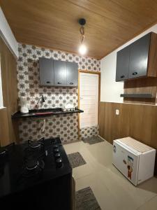 Kuchyň nebo kuchyňský kout v ubytování Flat Praia Grande