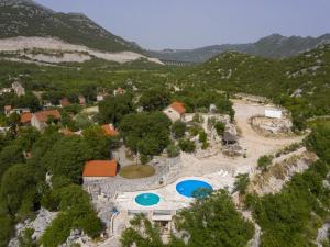 an aerial view of a resort with two swimming pools at Rustical Resort Kokori i Shared Pool - One Bedroom in Višnjica