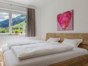Postel nebo postele na pokoji v ubytování Walser Lodge