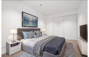 Ένα ή περισσότερα κρεβάτια σε δωμάτιο στο Queens Wharf hosted by AAB