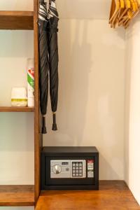 a microwave with an umbrella on a shelf at Bamboo Bay Eco Resort in Srithanu