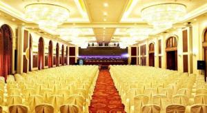 a large hall with rows of chairs in a theater at Teda Dalian in Dalian +144 photos