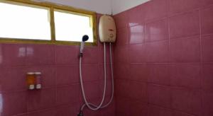 a bathroom with a shower in a pink tiled wall at 22 Seasons Hotel in Ban Khlong Chi Lat +41 photos