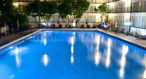a large blue swimming pool in a building at Magnuson Grand Conference Hotel in Cypress Gardens