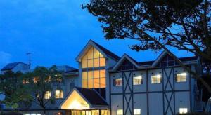 a building with its lights on in front of it at Hotel SP Haruno in Shinkawa