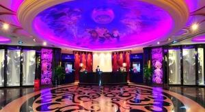 a lobby with a purple ceiling and a stage at Jinjiang Grandlink Hotel in Quanzhou +241 photos