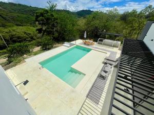 a swimming pool on top of a building at Casa Campestre San Jerónimo in Tocaima
