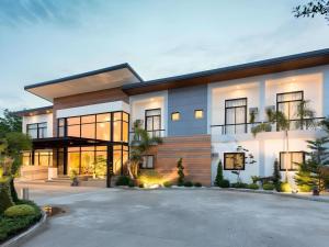 a large house with a driveway in front of it at Venue 88 in General Santos