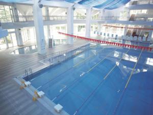 an overhead view of a large swimming pool at Nature Miraikan in Naha