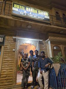 a group of men standing in front of a building at Hotel Darsh Safari - Fort View in Jaisalmer