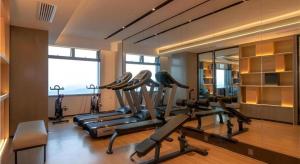 a gym with several exercise bikes in a room at Echarm Hotel Nanning Wuxiang Headquarters Base in Nanning +17 photos