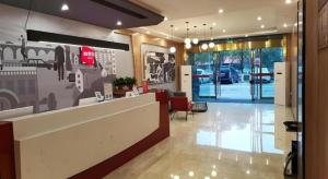 a lobby of a store with a reception desk and a lobby at Thank Inn Hotel Anqing Guangcai Big Market Passenger Center in Anqing