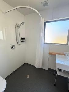 a bathroom with a shower and a sink at Kingston TOP 10 Holiday Park in Kingston +84 photos