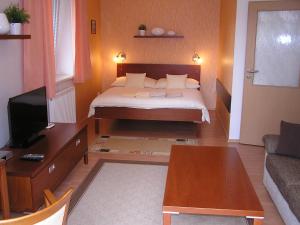 Postel nebo postele na pokoji v ubytování Gonda Apartments