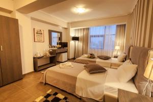 Postel nebo postele na pokoji v ubytování Aqua Mare Sea Side Rooms