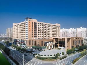 a large building with a street in front of it at Vienna Hotel Nanjing Zhongshan Mausoleum in Nanjing