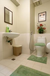 a bathroom with a toilet and a sink at La Verti Residences Unit 1420 I Skyline Views & Luxe Stay Near MOA in Manila