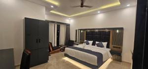 Ένα ή περισσότερα κρεβάτια σε δωμάτιο στο Munnar Family Castle