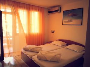 A bed or beds in a room at Villa Diana Self check-in