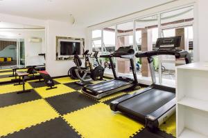 a gym with treadmills and ellipticals in a room at Fin Banchang in Ban Nong Chaeng +6 photos