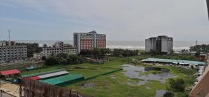 a view of a city with a river and buildings at Water Paradise Resort in Cox's Bazar