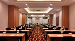 a large room with tables and chairs in it at Atrium Premiere Cilacap in Cilacap +118 photos