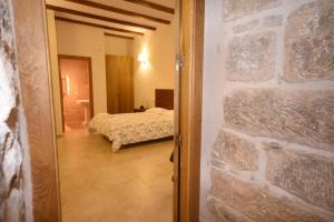 Postel nebo postele na pokoji v ubytování Apartamentos Casa Les Valeres